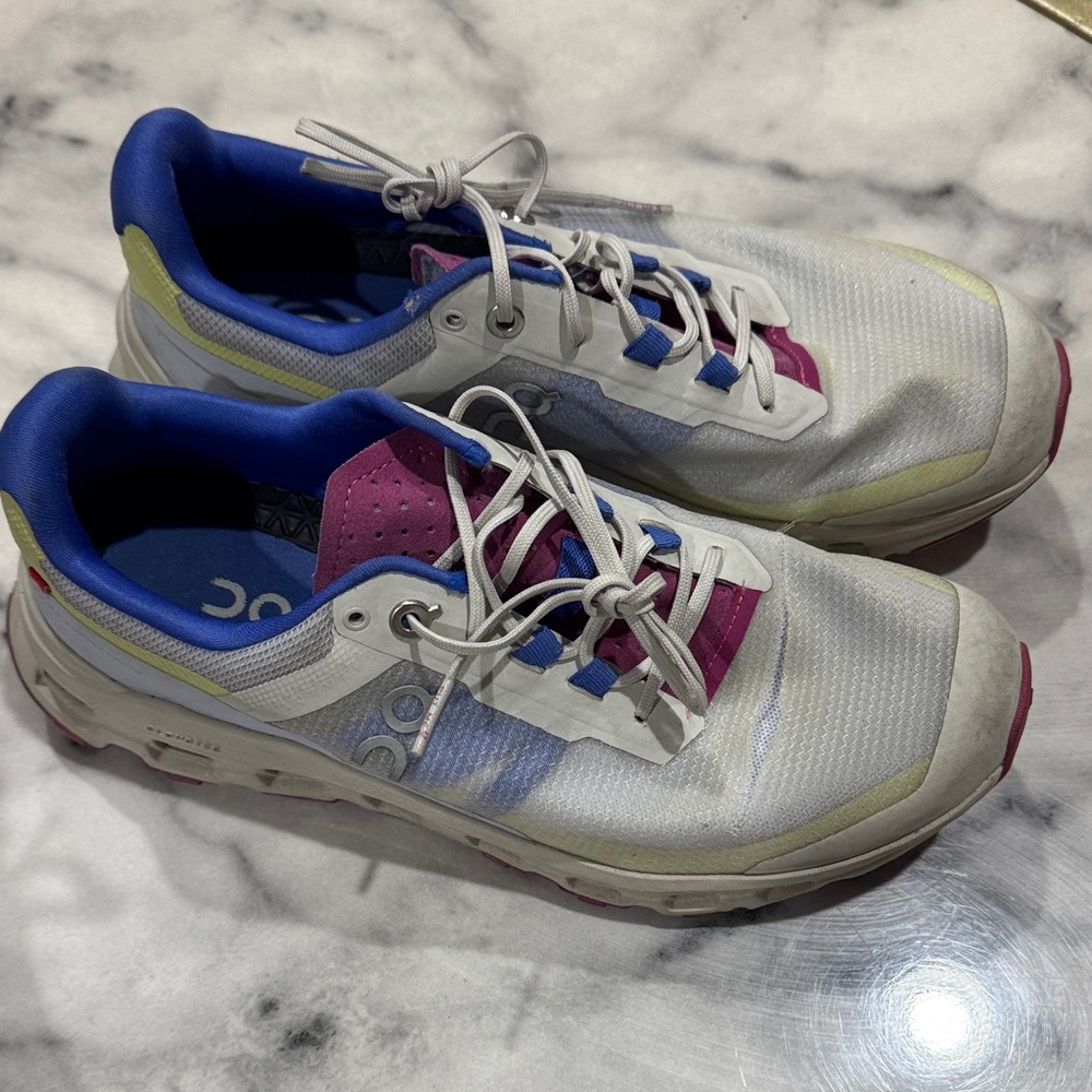 On Running White and Purple Sneakers